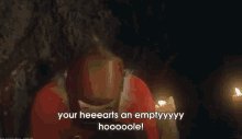 a person in a santa suit says your heeearts an emptyyyy hooooole