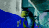 a cartoon character is standing in a room with a blue wall .