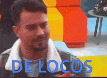 a man with a beard and the word de locos behind him