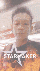 a man 's face is behind a star maker advertisement