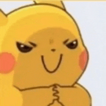 a close up of a pikachu cartoon character with an angry face and a smile .