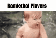 a naked baby is standing in the water with his mouth open .