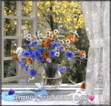 a bouquet of flowers in a vase on a window sill with the words happy mother 's day