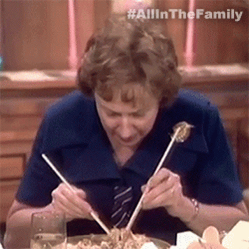 woman eating with chopsticks