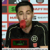 a man with a microphone in his mouth is wearing a shirt that says silba on it