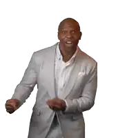 a man in a suit is celebrating with gold confetti falling on him