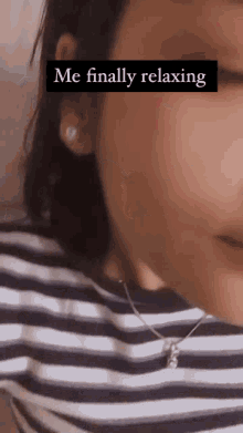 a close up of a woman 's face with the words `` me finally relaxing '' written on it .