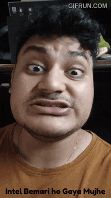 a man is making a funny face with the words intel bemari ho gaya mujh on the bottom