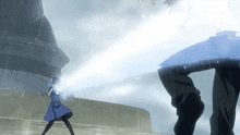 a woman in a blue dress is standing in the rain