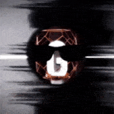 a person wearing sunglasses has the letter g on their head