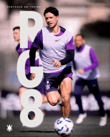 a soccer player in purple shorts is running with a soccer ball