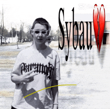 a person wearing a t-shirt that says sybau