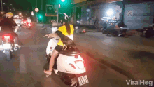 a woman riding a scooter with a license plate that says 50-11
