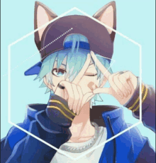 a boy wearing a cat ear hat and a blue jacket