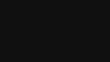 a green and red infinity symbol on a dark background