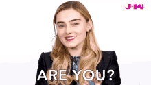 a woman says " are you " in front of a j14 logo