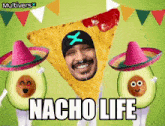 a man wearing a sombrero is standing next to two avocados with the words nacho life written on them