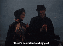 a man and a woman standing next to each other with the words there 's no understanding you