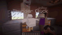 a person is playing a video game with a chicken standing in front of them