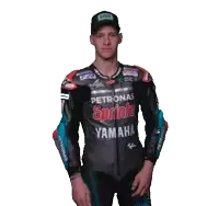 a man wearing a petronas sprinta yamaha jacket stands in front of a white background