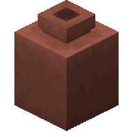 a brown block with a square hole in the middle of it .