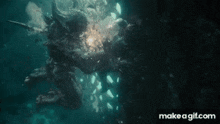a person is swimming in the water with a sword .