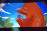 a cartoon drawing of a monster with its mouth open and sharp teeth