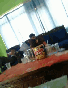a box of tango chips sits on a table in a living room