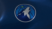 a logo for the minnesota timberwolves with a wolf howling