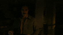 a man with a mustache says well like i said in a dark room