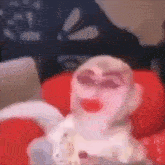 a blurry picture of a baby with sunglasses on .
