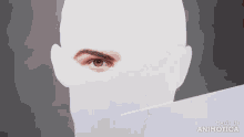 a person is drawing a man 's eye with a pencil .
