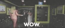 a woman in a naked dress is standing in a room with the words wow written on the bottom .