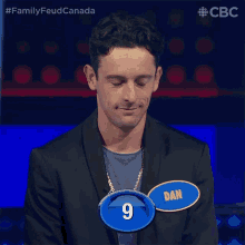 a man wearing a name tag that says dan