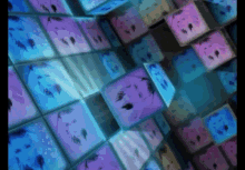a bunch of squares with faces on them are lined up on a wall