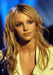 a close up of a woman 's face with blonde hair