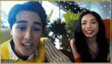 a man and a woman are smiling and looking at the camera ..