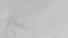 a black and white drawing of a person kicking a ball on a white background .