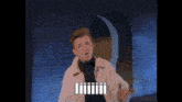 a man in a white jacket is standing in front of a brick wall with the words " iiiiii " below him