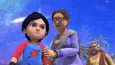 a boy in a superhero shirt is standing next to an older woman and a man .