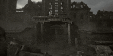 a black and white photo of a ruined building with stairs