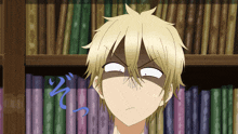 a boy with blonde hair making a surprised face in front of a bookshelf