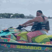 a man is riding a jet ski that says sea 400 on it