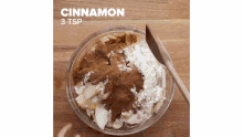 a glass bowl filled with cinnamon and powdered sugar