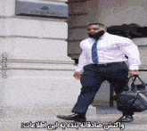 a man in a suit and tie is carrying a bag