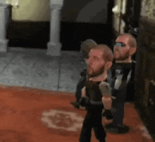 a blurry picture of a man with a beard and sunglasses