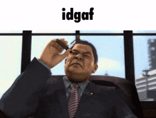 a man in a suit and tie is smoking a cigar while sitting in front of a window .
