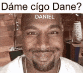 a close up of a man 's face with the words dame cigo dane daniel on top