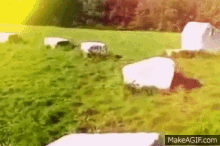 a painting of a cemetery with the website makeagif.com visible