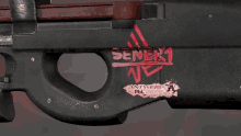 a close up of a gun with a sticker on it that says sene1